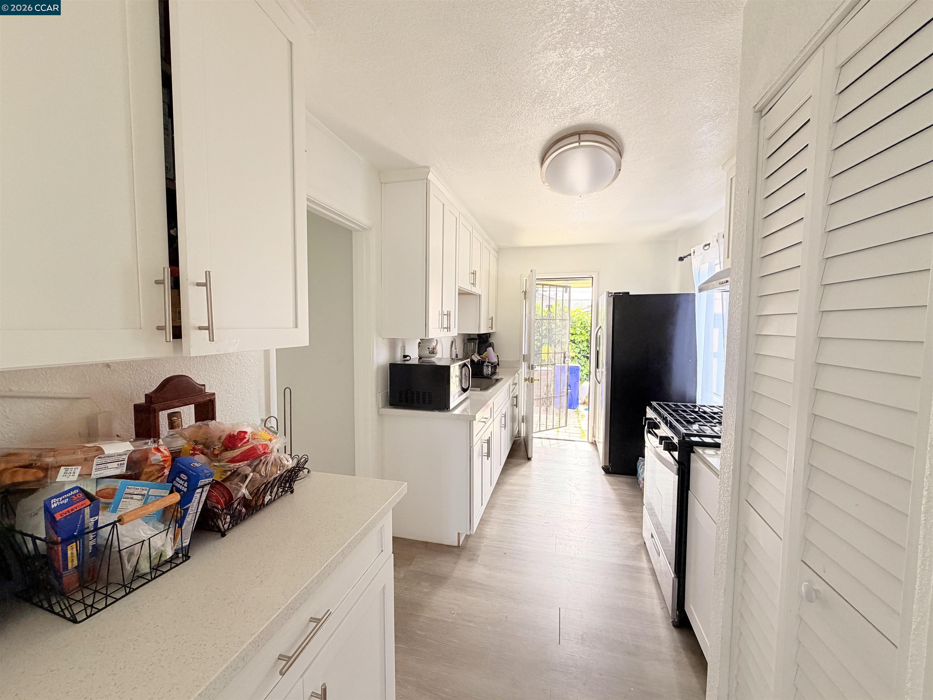 238 Fitzpatrick Road Oakland, CA 94603 - Photo 7 of 18 a utility room with sink dryer and washer