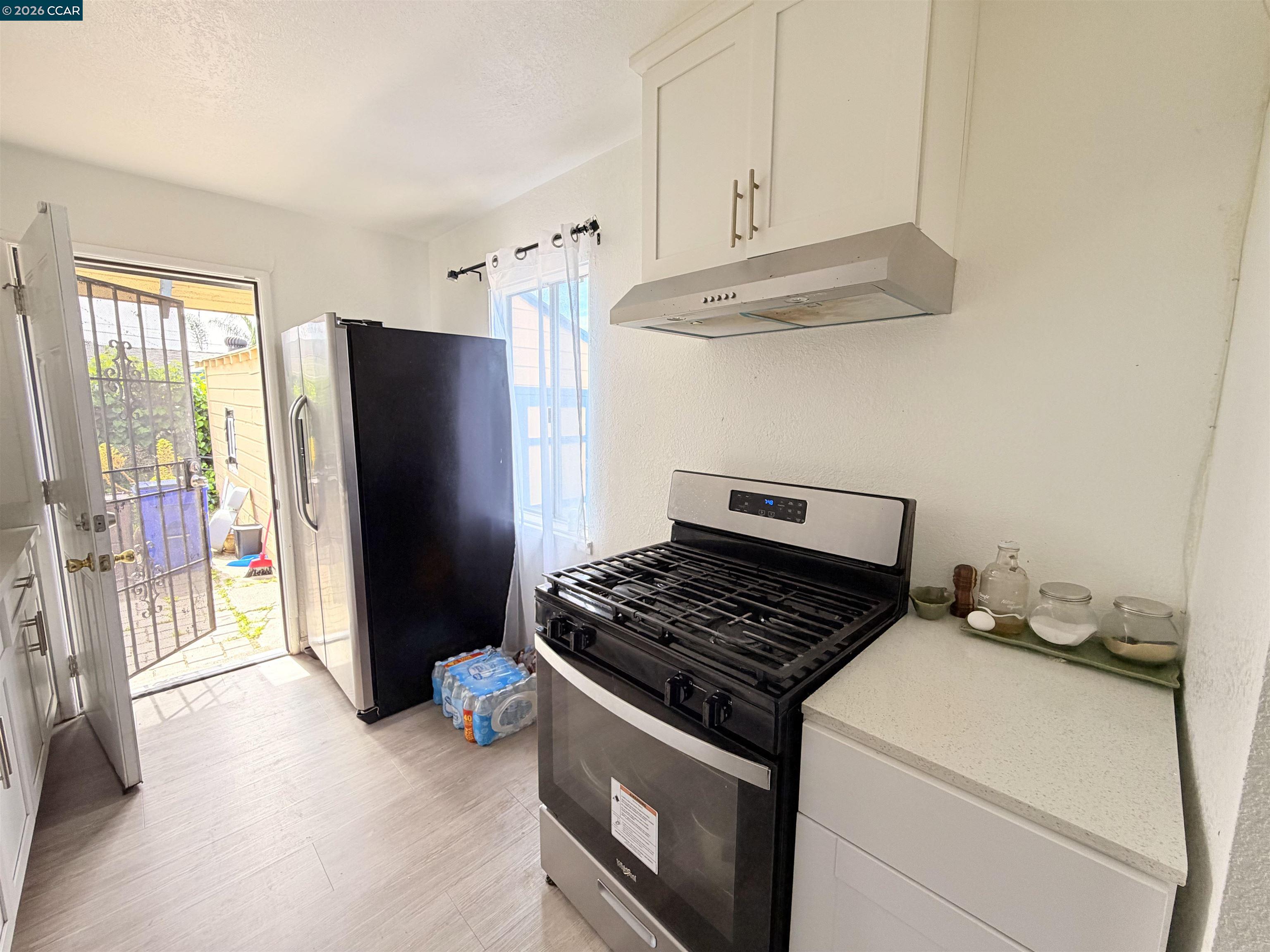 238 Fitzpatrick Road Oakland, CA 94603 - Photo 8 of 18 a kitchen with stainless steel appliances granite countertop a refrigerator and a stove