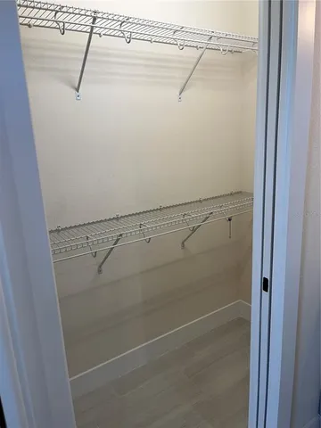 a view of a room with racks on the wall