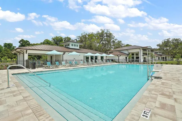 a view of house with a yard