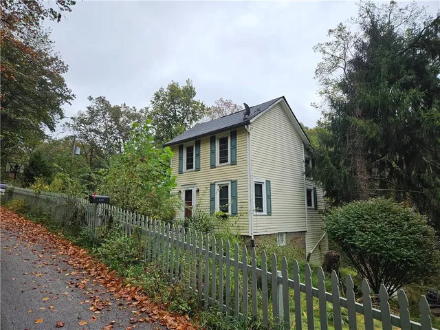 a house view with a garden space