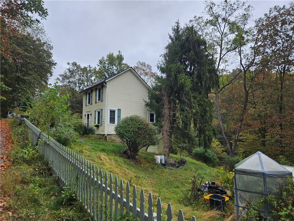 3132 Baker School Road Irwin, PA 15642 - Photo 3 of 5 a view of a garden with plants and large trees