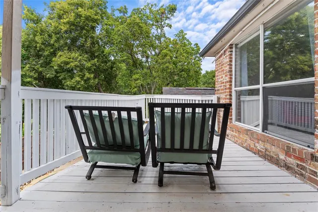 a bathroom with a granite countertop sink a mirror and a bathtub
