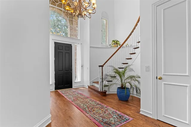 a view of an entryway with wooden floor