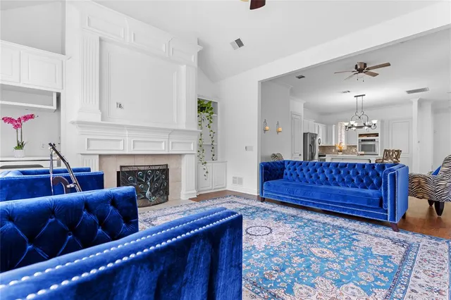 a living room with furniture a couch and a fireplace