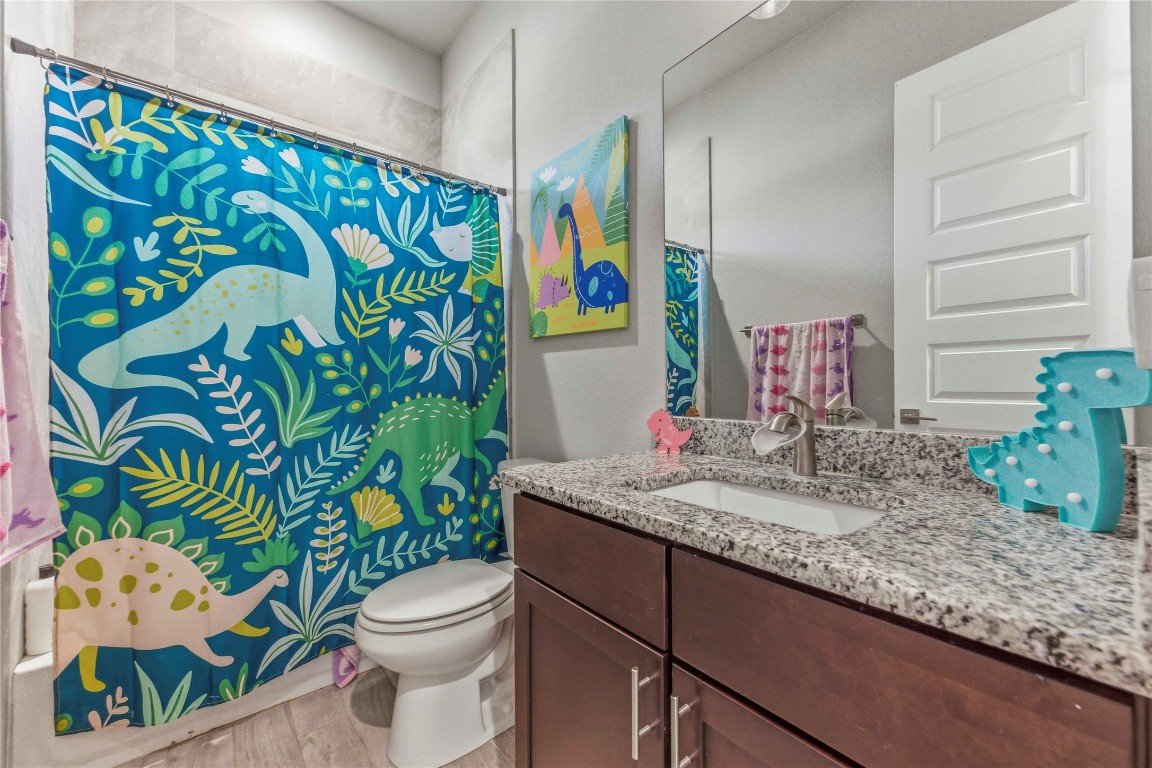 184 Granite Road Spring Branch, TX 78070 - Photo 17 of 27 Bathroom with vanity and light wood finished floors