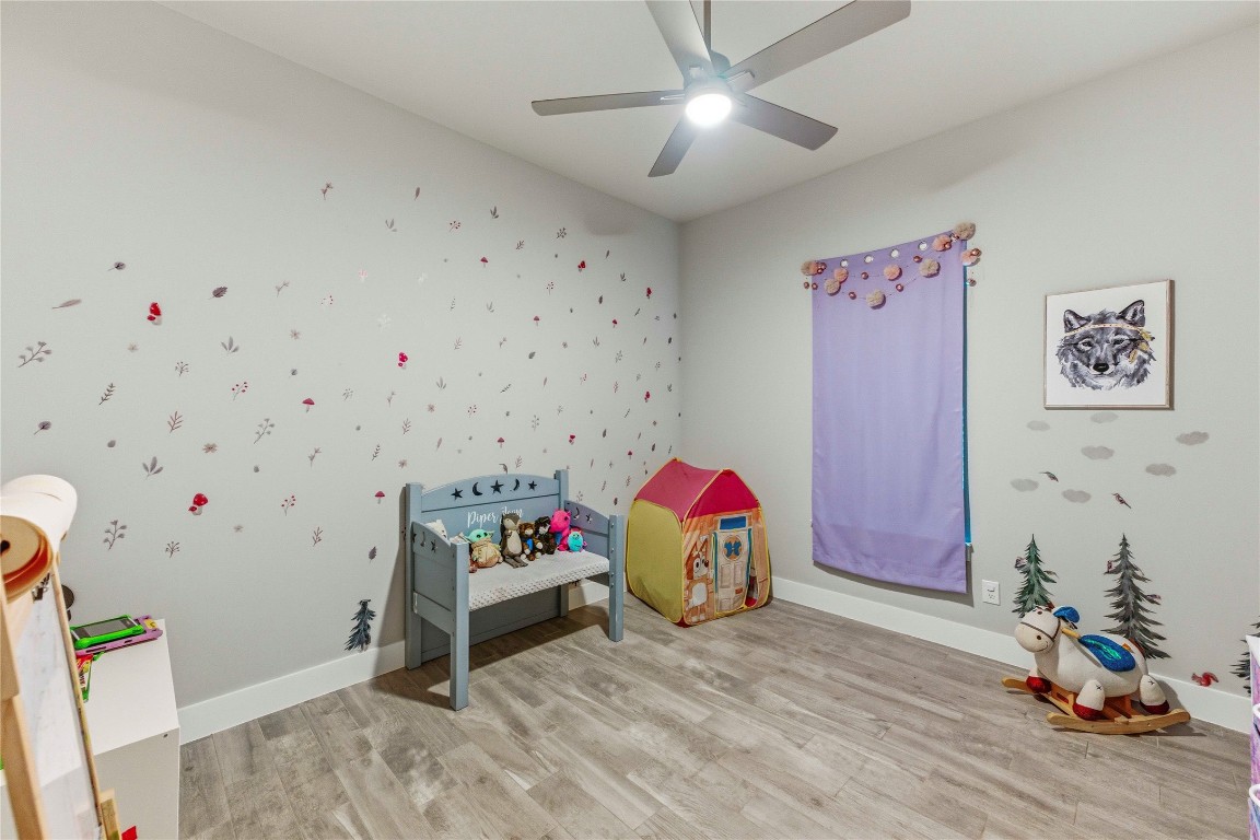 184 Granite Road Spring Branch, TX 78070 - Photo 18 of 27 Playroom featuring light wood-type flooring and a ceiling fan