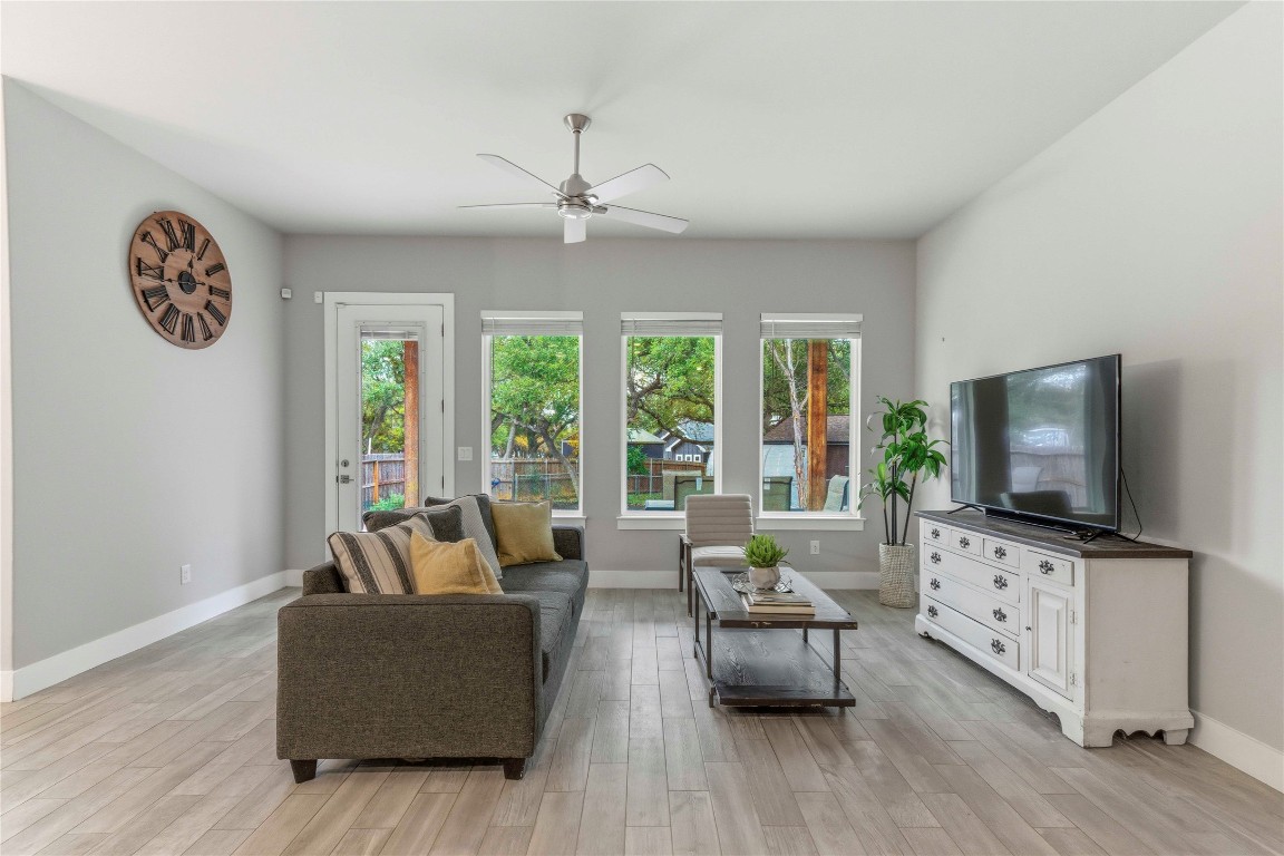 184 Granite Road Spring Branch, TX 78070 - Photo 3 of 27 Living area featuring wood finish floors, healthy amount of natural light, and a ceiling fan