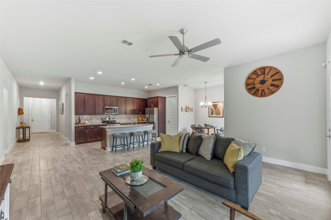 184 Granite Road Spring Branch, TX 78070 - Photo 4 of 27 Living room featuring light wood finished floors, recessed lighting, a chandelier, and ceiling fan
