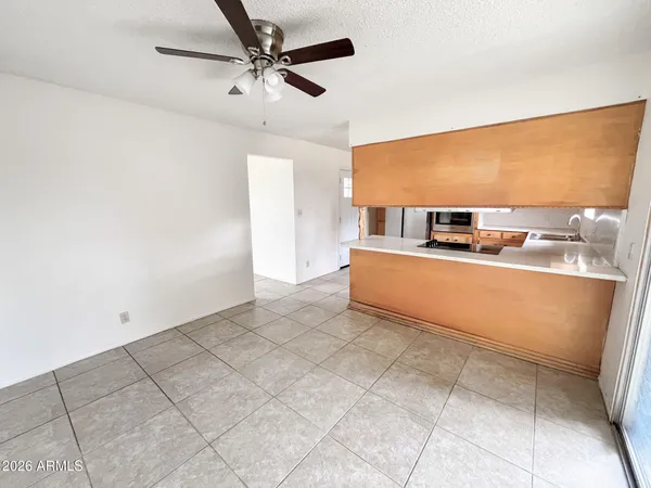 a kitchen with stainless steel appliances granite countertop a refrigerator sink and cabinets