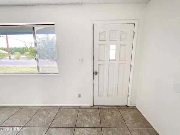 a view of an empty room with a window