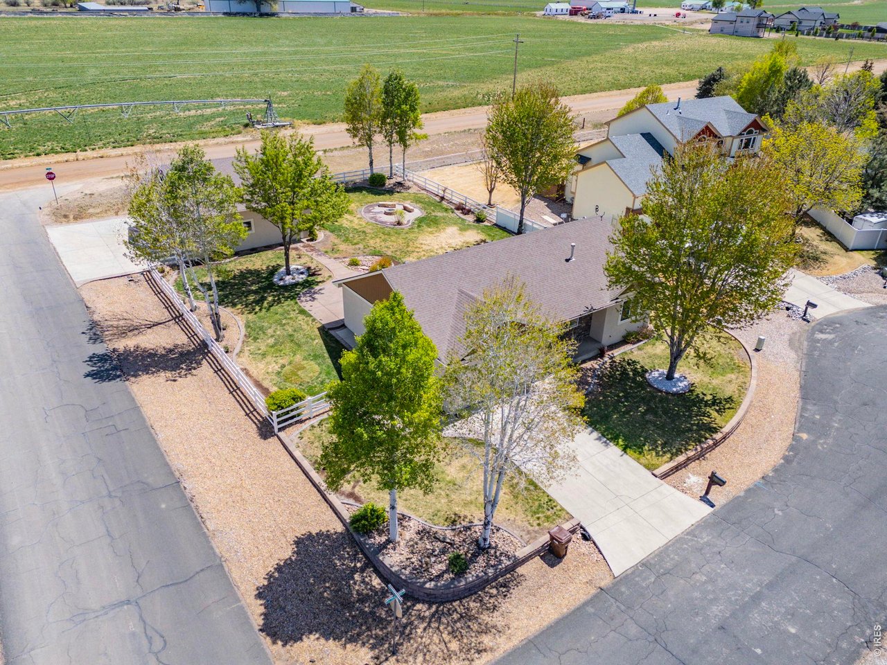 2002 Trail Ridge Drive Severance, CO 80615 - Photo 3 of 50 Situated on a private corner lot in a quiet cul-de-sac, this property backs to farm ground offering a peaceful, tucked-away feeling while still being conveniently close to town and ample amenities.