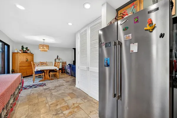 a view of a livingroom with furniture and a flat screen tv