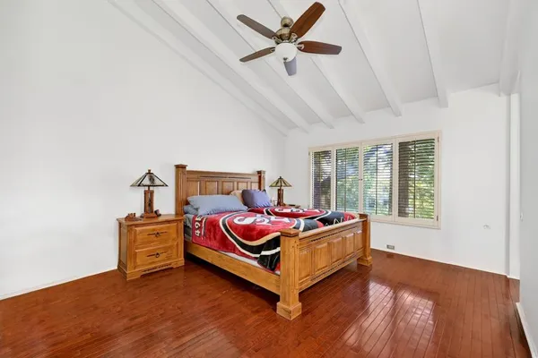 a room with a bed and window