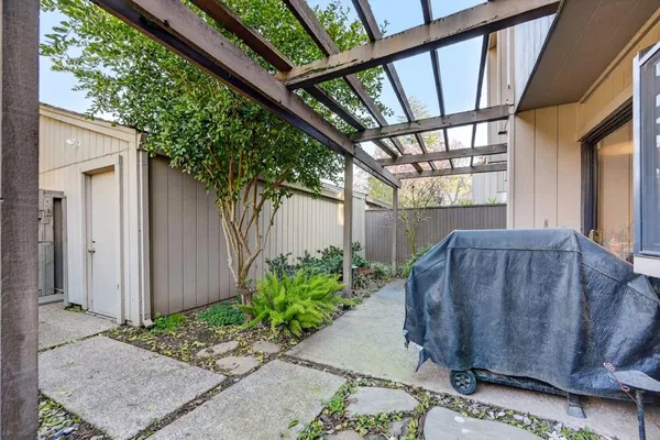 a view of a porch with wooden floor