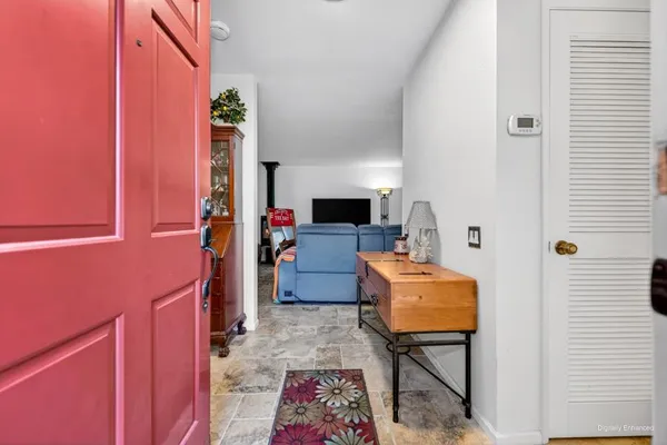 a room with furniture and a flat screen tv