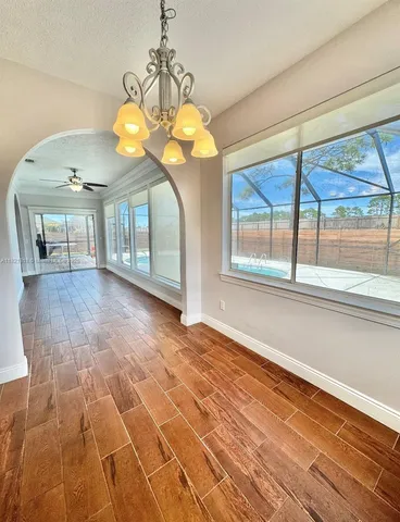 a kitchen with stainless steel appliances granite countertop a stove and a sink