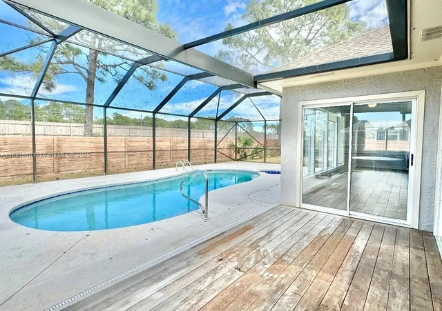 a view of swimming pool with a patio