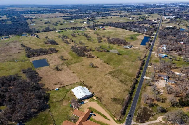 an aerial view of residential house and outdoor space