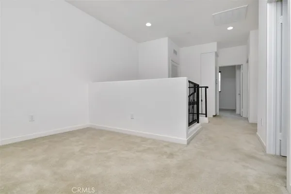 a view of a hallway with washer and dryer