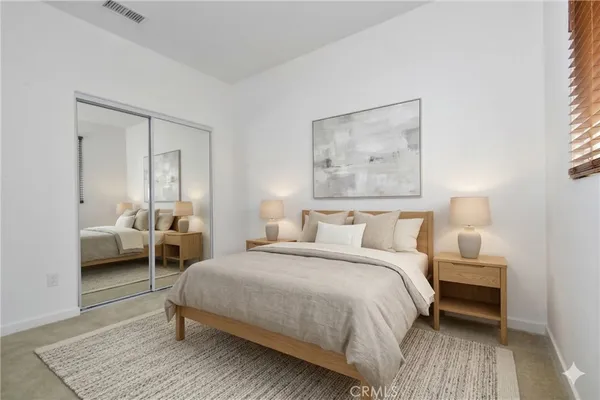 an empty room with closet area