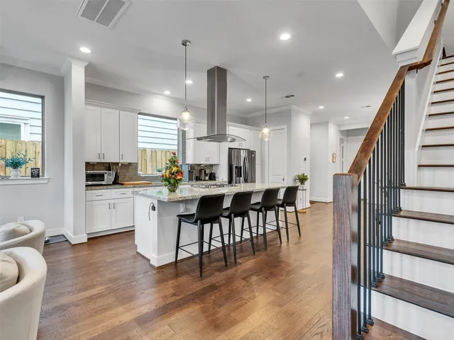 a kitchen with counter space appliances and a dining table