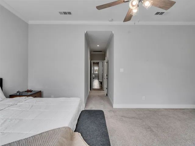 a bedroom with a bed and lamp