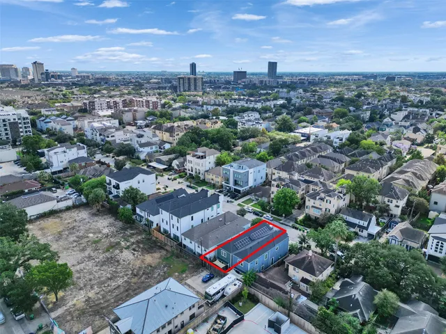 an aerial view of a city with lots of residential buildings