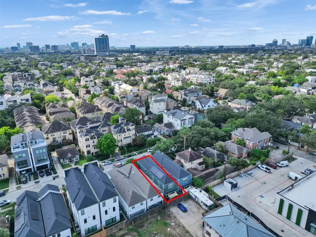 an aerial view of a city with lots of residential buildings