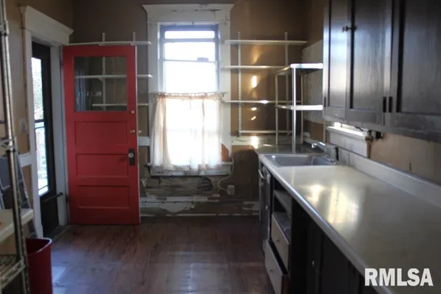 a bathroom with a double vanity sink and a window