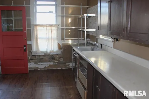 an empty room with wooden floor