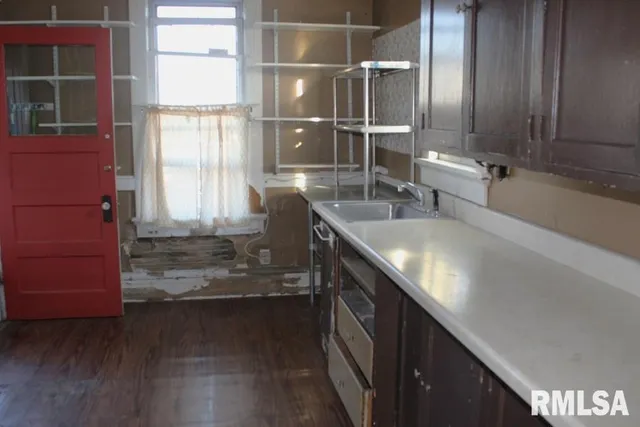 an empty room with wooden floor