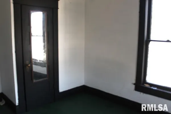 a room with furniture and a window