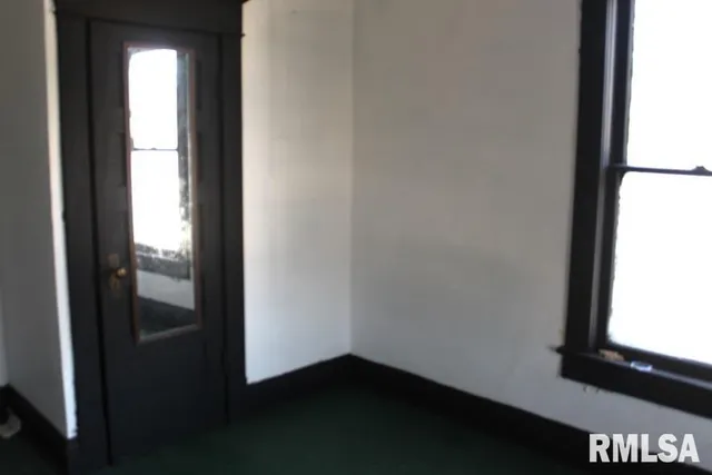 a room with furniture and a window