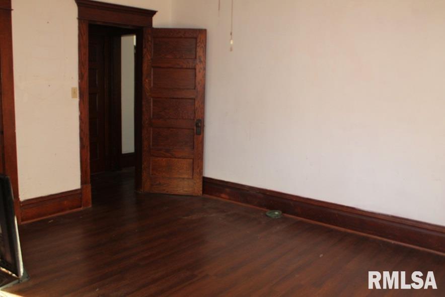 714 South Main Street Kewanee, IL 61443 - Photo 6 of 31 a view of an empty room with wooden floor and closet