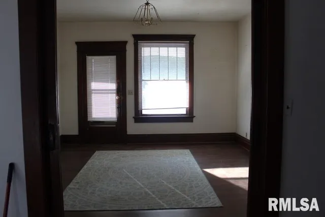 a view of empty room with windows