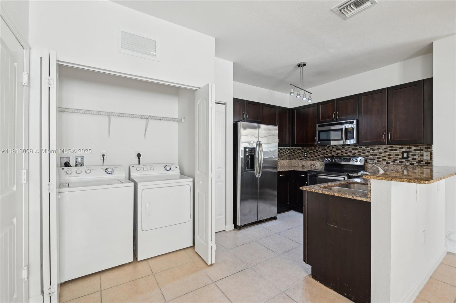 14110 Southwest 275th Street, Unit 14110 Homestead, FL 33032 - Photo 15 of 51 Kitchen/Laundry