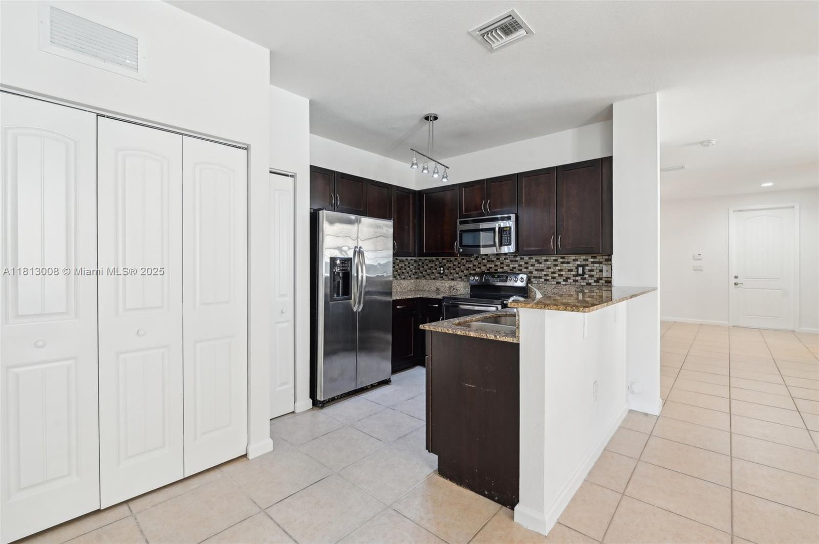 14110 Southwest 275th Street, Unit 14110 Homestead, FL 33032 - Photo 16 of 51 Kitchen/Laundry