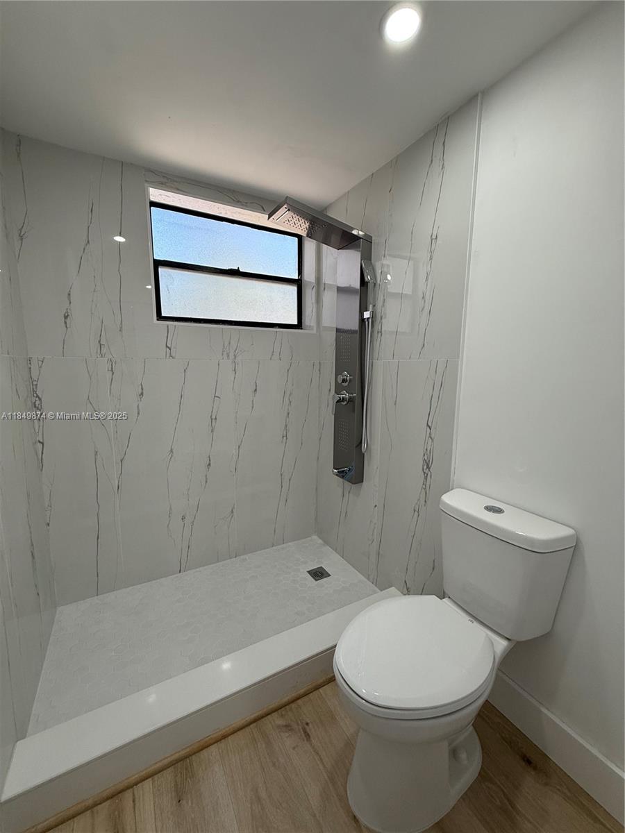 7950 West McNab Road, Unit 102 Tamarac, FL 33321 - Photo 14 of 34 a bathroom with a toilet and a shower