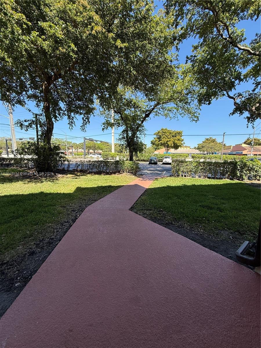 7950 West McNab Road, Unit 102 Tamarac, FL 33321 - Photo 30 of 34 a view of a park with large trees