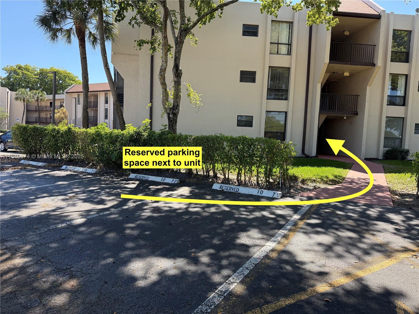 7950 West McNab Road, Unit 102 Tamarac, FL 33321 - Photo 31 of 34 a view of a house with a yard and potted plants