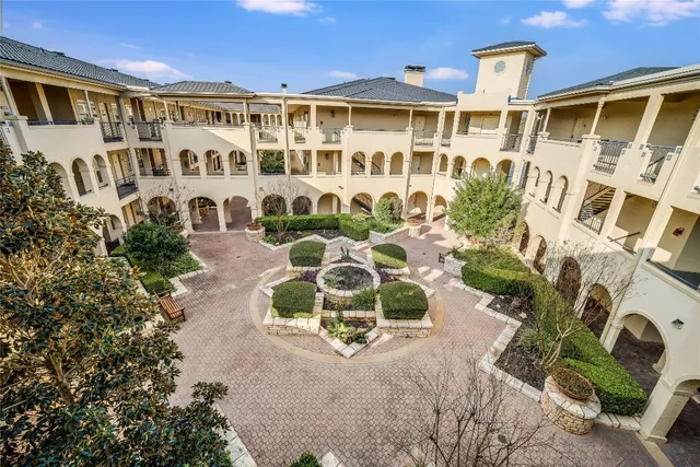 a front view of a building with outdoor seating
