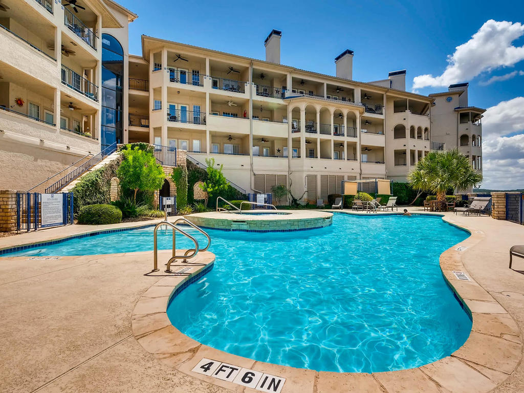 3404 American Drive, Unit 3300 Lago Vista, TX 78645 - Photo 17 of 39 a view of a building with a swimming pool