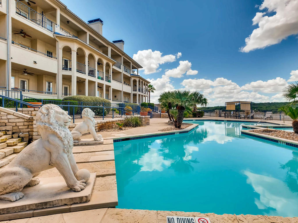 3404 American Drive, Unit 3300 Lago Vista, TX 78645 - Photo 18 of 39 a swimming pool with outdoor seating and yard