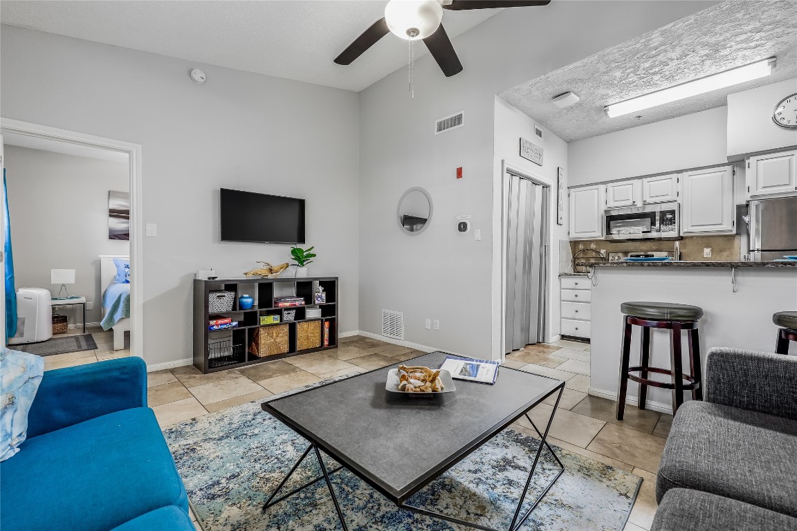 3404 American Drive, Unit 3300 Lago Vista, TX 78645 - Photo 2 of 39 a living room with furniture and a flat screen tv