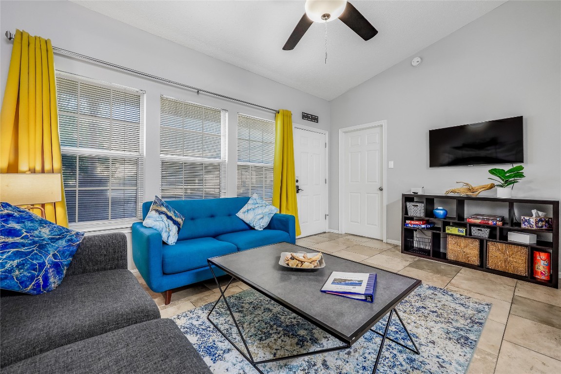 3404 American Drive, Unit 3300 Lago Vista, TX 78645 - Photo 24 of 39 a living room with furniture and a flat screen tv