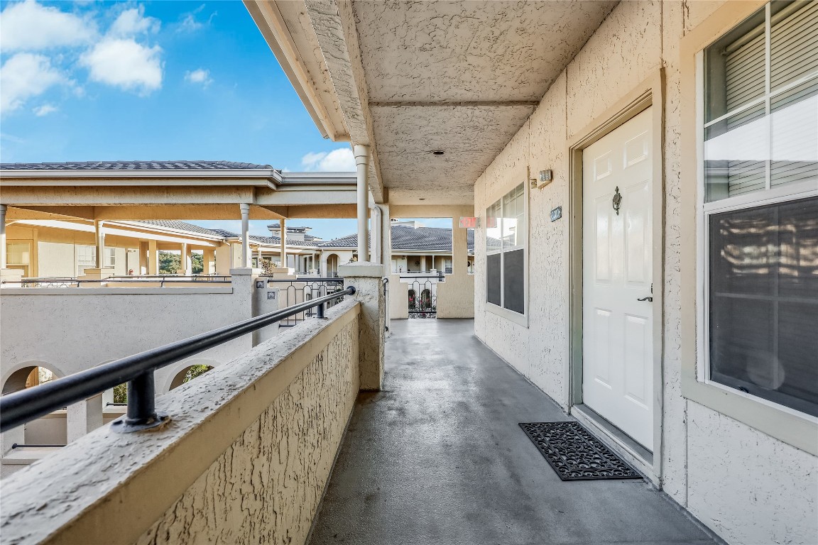 3404 American Drive, Unit 3300 Lago Vista, TX 78645 - Photo 26 of 39 a view of a hallway with the wooden floor and staircase