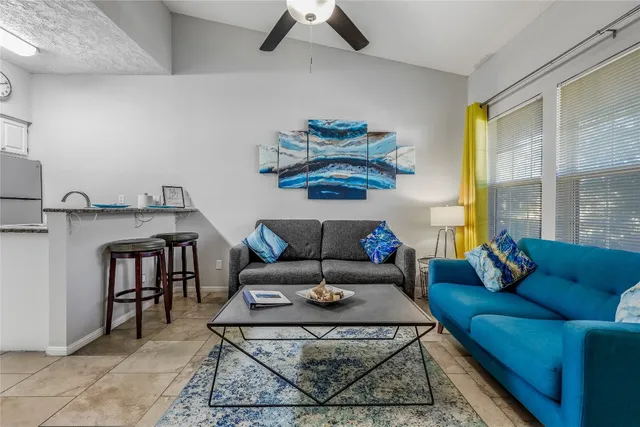 a living room with furniture and a table