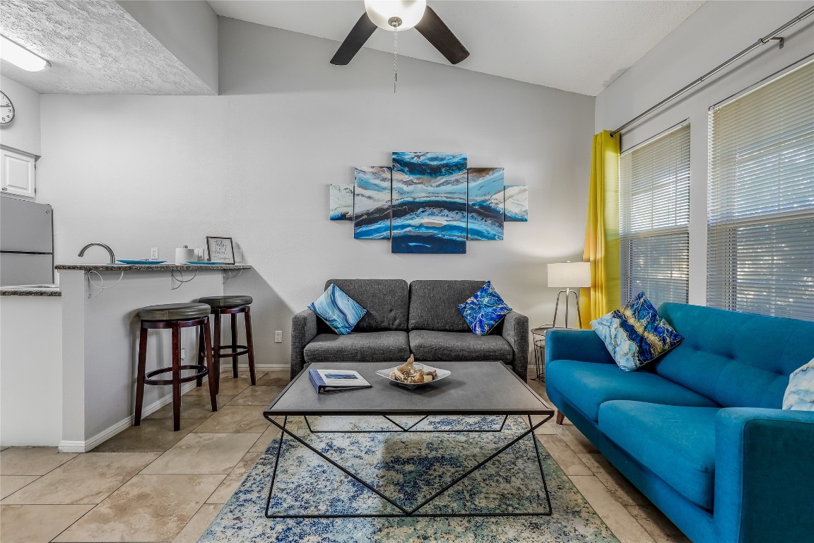3404 American Drive, Unit 3300 Lago Vista, TX 78645 - Photo 3 of 39 a living room with furniture and a table