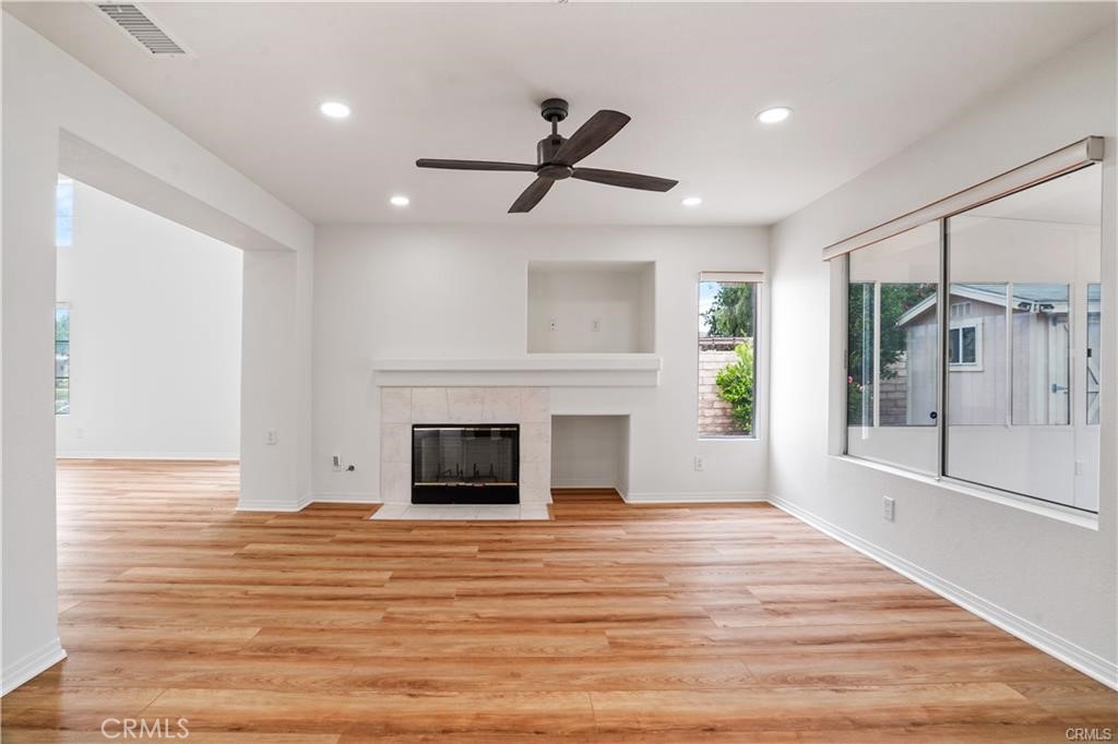 701 Caliente Way Oxnard, CA 93036 - Photo 2 of 7 a view of empty room with wooden floor and fireplace